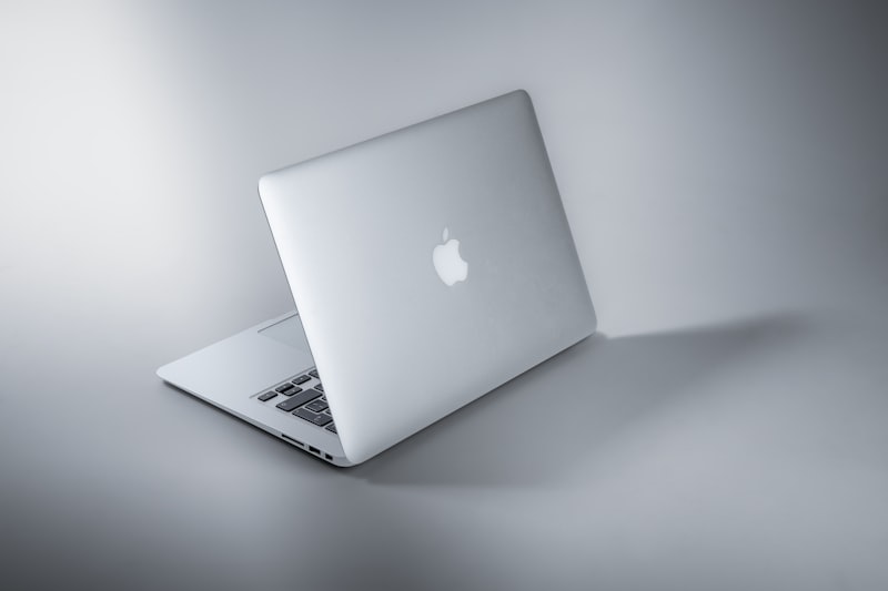 Silver MacBook on clean desk surface